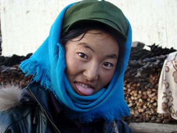 tibetan woman sticking her tongue out at me